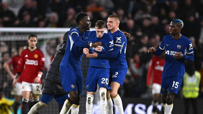 Chelsea's Cole Palmer celebrates scoring his fourth goal against Manchester United with Benoit Badiashile and Alfie Gilchris